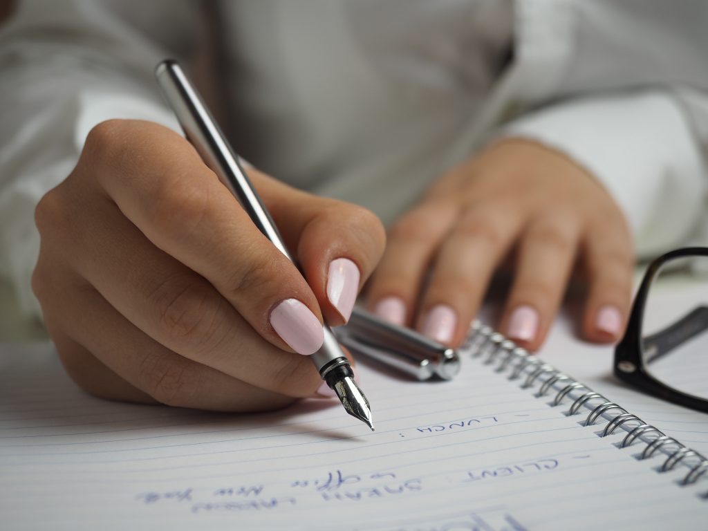 Woman writing something.