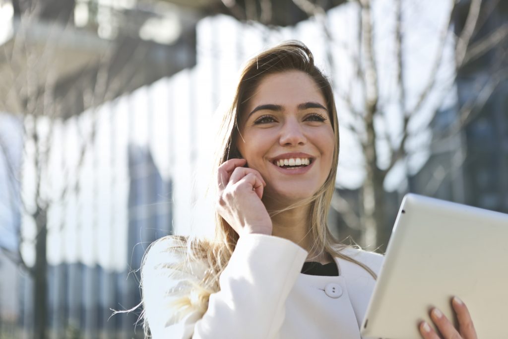 A GirlBoss holding a tablet